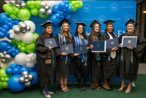 Galen College of Nursing graduates pose with their degrees.