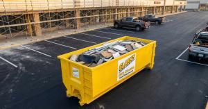 Clarks Dumpster and Hauling Services 30 yard roll off dumpster at commercial construction site