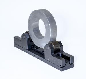 it is an adjustable roll cradle with a large part in between the two adjustable lifts for roll marking