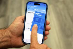 Inspector using HomeInspections.com software to conduct a home inspection on-site.