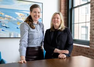 Professional portrait of Carter Williams, newly promoted to Associate Principal, left, and Erin Tracey, newly promoted to Principal, right, at LDa Architecture & Interiors.