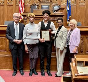 Mark Sain's wife, sister and grandson accepting the award on his behalf