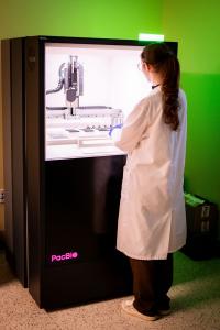 Laboratory technologist loads long-read sequencer