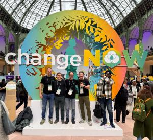 Team EcoVerum celebrating in front of a screen displaying the Change 100 Winners list at ChangeNOW at the Grand Palais in Paris 2026, with EcoVerum named among the most impactful startups to watch in 2026.
