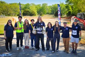 The Gould Engineering team poses with their rover at the finish line of the Rover Challenge