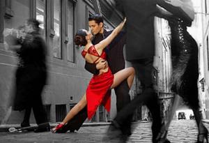 Argentine tango dancers performing an intimate after‑dark dance on a New York City street, symbolizing passion, movement, and luxury nightlife culture.