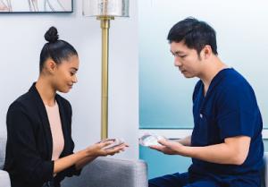 Dr. Tseng meeting with a patient.
