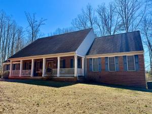The custom built 4 BR/3 BA Greystone Home features a partially finished basement with a bedroom and bathroom, attached garage, large rear deck and screened porch and is conveniently located only .7 miles off of Rt. 29, 3 miles from downtown Madison, VA.