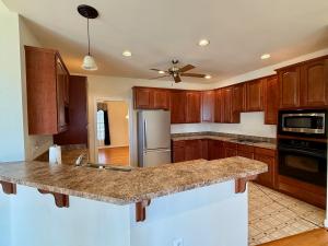 The custom built 4 BR/3 BA Greystone Home features a partially finished basement with a bedroom and bathroom, attached garage, large rear deck and screened porch and is conveniently located only .7 miles off of Rt. 29, 3 miles from downtown Madison, VA.