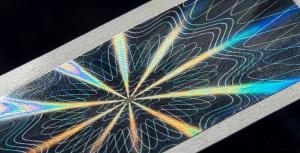 A hologram label featuring geometric designs.