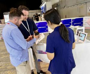 The buzz is real! Attendees line up to experience FotoCube’s new Smart Calendar Display at the show