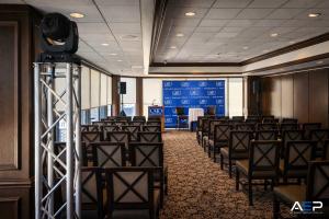 Corporate audiovisual setup with seating and presentation screen for a conference in Austin, Texas.