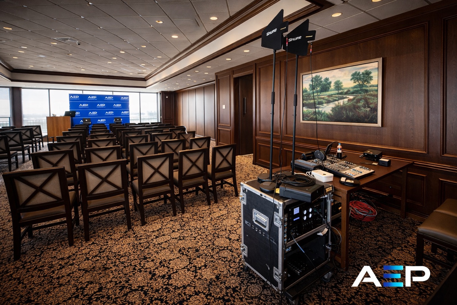 Business event setup with rows of chairs and AV presentation equipment in a conference space in Austin, Texas.