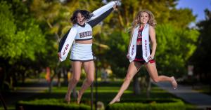 senior portrait session outdoor graduation cap and gown jumping photo