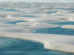 The surreal landscape of Lençóis Maranhenses National Park. This unique ecosystem is a top priority for Brazil's sustainable travel expansion. Credit: PlanetaEXO