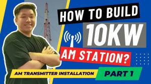 Graphic titled "How to Build 10kW AM Station? AM Transmitter Installation Part 1." It features an FMUSER engineer smiling with crossed arms next to a tall red and white radio antenna tower.