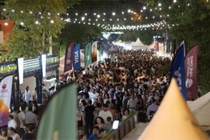 Aerial panoramic photography of a massive crowd of people filling Saryan and Moskovyan streets in Yerevan, Armenia, during the vibrant open-air Yerevan Wine Days festival.