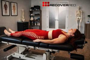 A woman waiting in a professional care center waiting for red light therapy