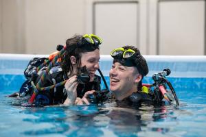 Two Scuba Show attendees in the "Try Diving" Pool wearing scuba gear