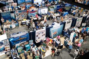Overview of the Scuba Show floor with vendor booths and many attendees