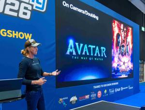 Underwater stunt performer, freediver and dive professional Liz Parkinson speaking on stage
