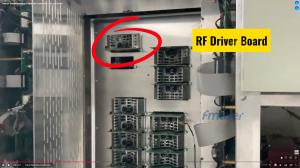 Interior view of a transmitter cabinet featuring multiple stacked metal modules. A prominent red circle highlights the top-left module, accompanied by a yellow text box reading "RF Driver Board."