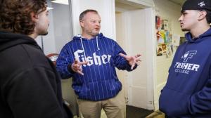 Coach Scott Dulin with Fisher College athletes on campus.