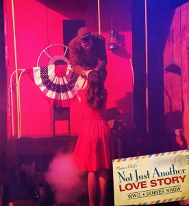 A woman says goodbye to a soldier on the back of a train