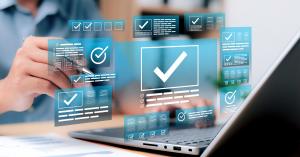 Person using a laptop with digital checkmark icons and verification interfaces overlaid.