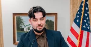 Oleksandr Bondar, Founder of Jazters AI Lab, speaking at a podium