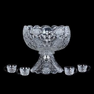 Two-part American Brilliant Cut Glass (ABCG) punch bowl signed Hawkes in the Queens pattern. Included are four matching punch cups signed Hawkes. Estimate: $3,000-$5,000