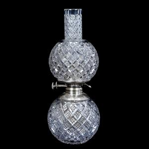 Diminutive Gone With the Wind table lamp, 17 inches in height, having a diamond cut motif with matching shade and chimney and original R.H. Macy & Co. font works. Estimate: $1,000-$1,600