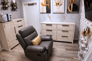 Modern EBOO treatment room featuring recliner chair, medical cabinetry, and a clean, organized clinical environment.