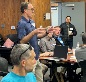 Teacher presenting to peers during CTE professional development focused on workforce readiness and classroom practice