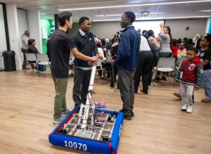 Members of TGR Learning Lab Philadelphia's Tiger Robotics Team practices with their robot, Tinker Tiger, preparing for the FIRST® Robotics World Championship.