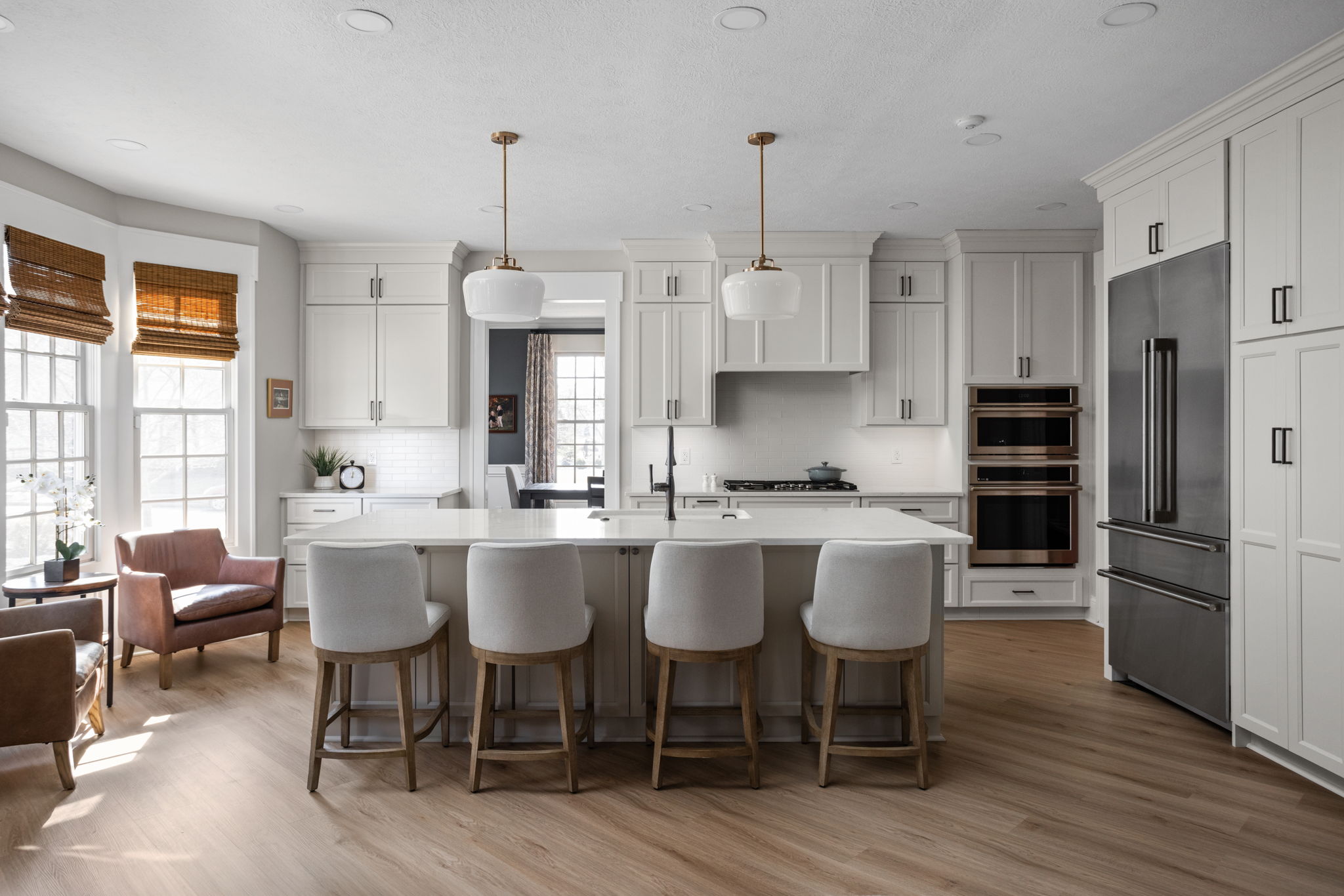 Indianapolis Kitchen Remodel by Worthington Design & Remodeling with A modern traditional inspired kitchen with a large island and white cabinetry and dual wall ovens
