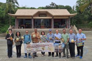 International delegation visiting a Siraya community in Danei, Taiwan, observing Indigenous cultural practices and discussing carbon governance and sustainability.
