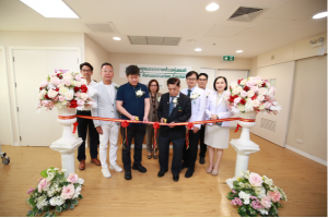 Representatives from RoboCT and Ladprao General Hospital cut a ribbon together during the official launch of their rehabilitation robotics collaboration in Bangkok.