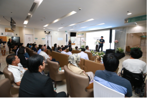 A RoboCT representative presents to guests about the partnership with Ladprao General Hospital and RoboCT’s rehabilitation products and technologies.