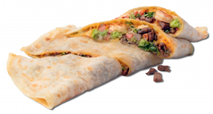 A flour tortilla quesadilla cut open, filled with grilled beef, guacamole, and fresh toppings.