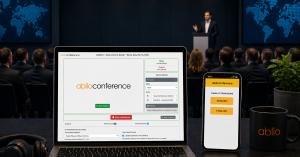 Conference presentation with Ablio AI interpretation on laptop and smartphone, showing real-time multilingual audio and captions for events