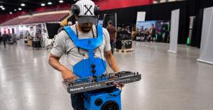 Walkabout Carriers BoomCube wearable workstation used by DJ in a live environment.