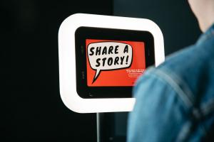 Voast screen showing a speech bubble that says "Share a Story", beginning the interview.