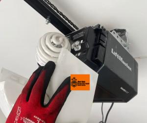 A heavy residential garage door hanging off its tracks before being safely realigned by a Next Hour technician in Saugus.