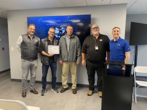 Leadership from S3 AeroDefense accept the FAA Diamond Award of Excellence from FAA inspectors