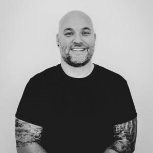 Ryan Virden, leadership coach and author, pictured in a professional headshot, known for his work on cultural identity, communication, and organizational change.