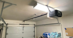 Close-up of a Pasadena Garage Door Repair technician safely installing a new heavy-duty torsion spring on a residential door.