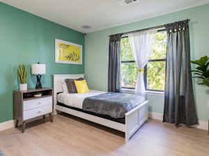 calming bedroom with a bed twin size bed and a dresser