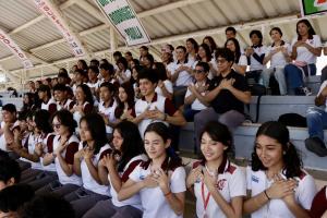 Players place their hands on their hearts on the field in Mexico as part of a Fair Play ritual.