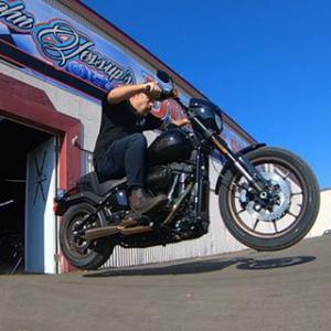 John Jessup riding a black motorcycle